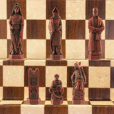 Chess pieces with a Crusades theme, including figures like King Richard the Lionheart and Saladin, displayed on a chess board.
The chess set concentrates particularly on the Third great Crusade led by King Richard I of England, who in 1189 joined King Philip II of France in an effort to recapture the holy city of Jerusalem. King Richard, with 8000 troops, seized Cyprus and some cities on the Palestinian coast, but ultimately failed to dislodge the Muslim leader Saladin from Jerusalem.